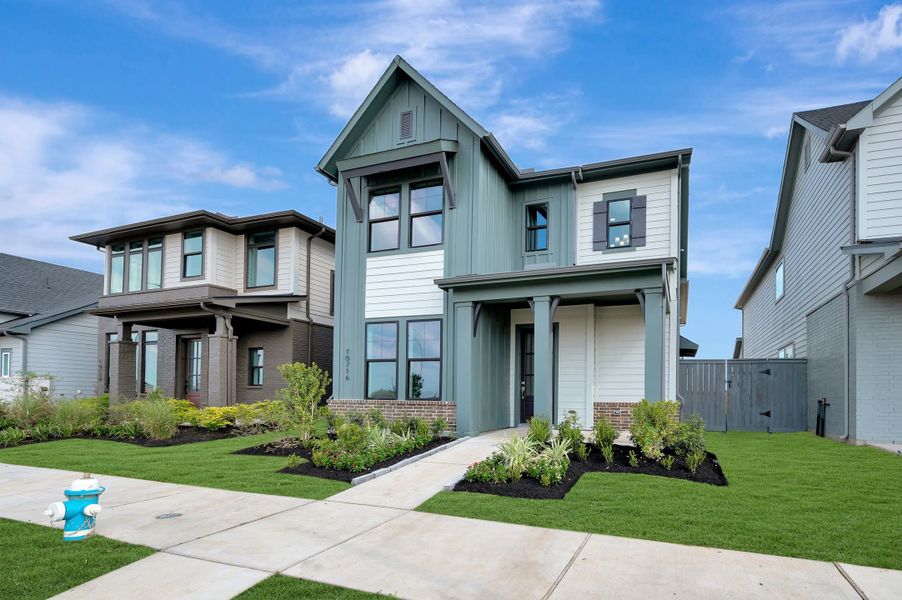 Front exterior of a new home in Jubilee - Cottages Row Collection, Hockley, TX, highlighting curb appeal (Image 2). Front exterior of a new home in Jubilee - Cottages Row Collection, Hockley, TX, highlighting curb appeal (Image 2).