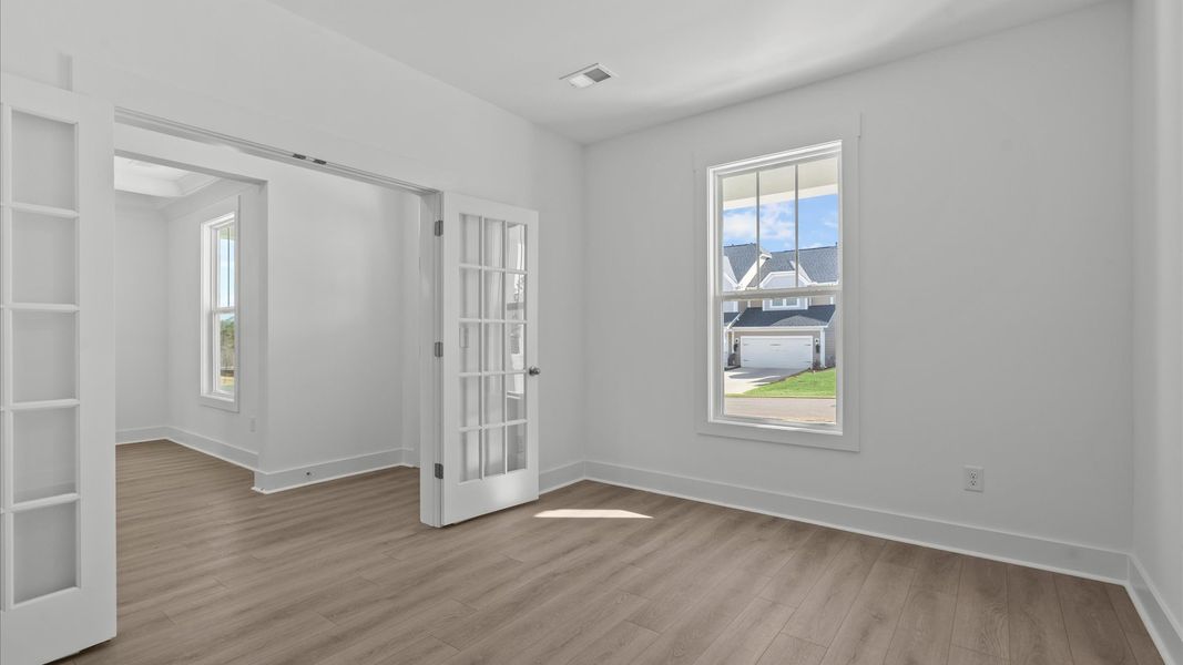 First-class home office behind elegant French doors designed with high standards in mind