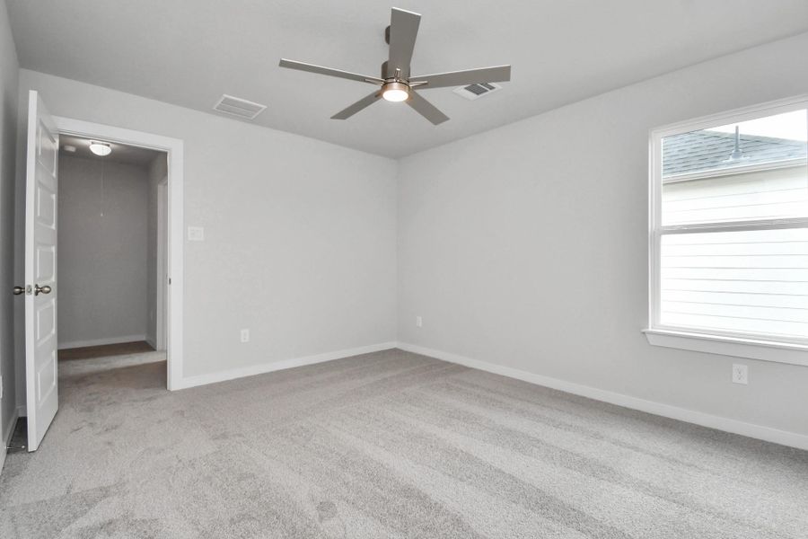 Generously sized secondary bedrooms featuring spacious closets, soft and inviting carpeting underfoot, large windows allowing plenty of natural light, and the added touch of privacy blinds for your personal retreat. Sample photo of completed home with similar floor plan. Actual colors and selections may vary. Generously sized secondary bedrooms featuring spacious closets, soft and inviting carpeting underfoot, large windows allowing plenty of natural light, and the added touch of privacy blinds for your personal retreat. Sample photo of completed home with similar floor plan. Actual colors and selections may vary.