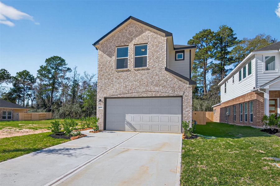 Front exterior of a new home in Enclave at Willis, Willis, TX, highlighting curb appeal (Image 25).