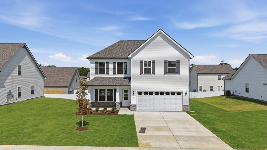 Front exterior of a new home in Wheatfield, Shelbyville, TN, highlighting curb appeal (Image 17).