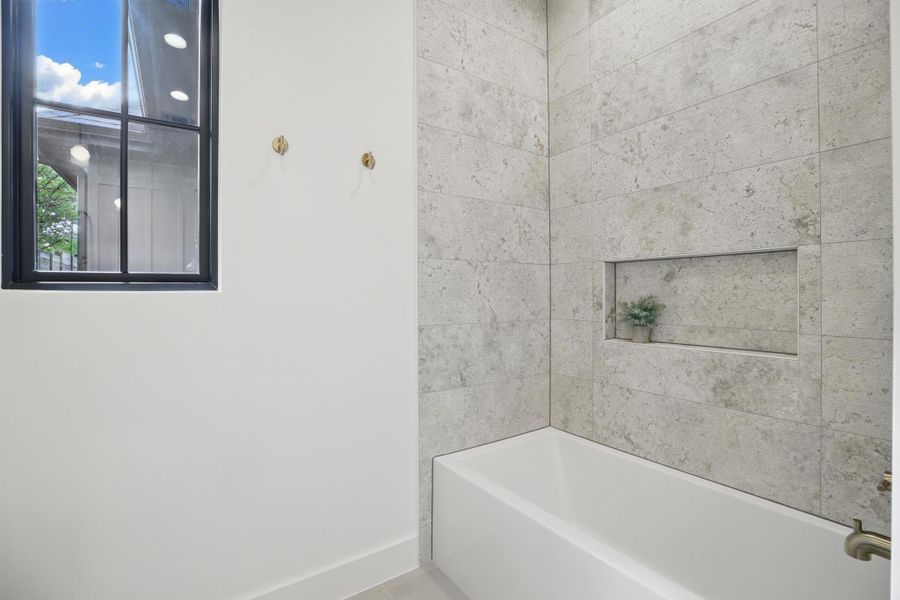 Full bath with a tub to relax in