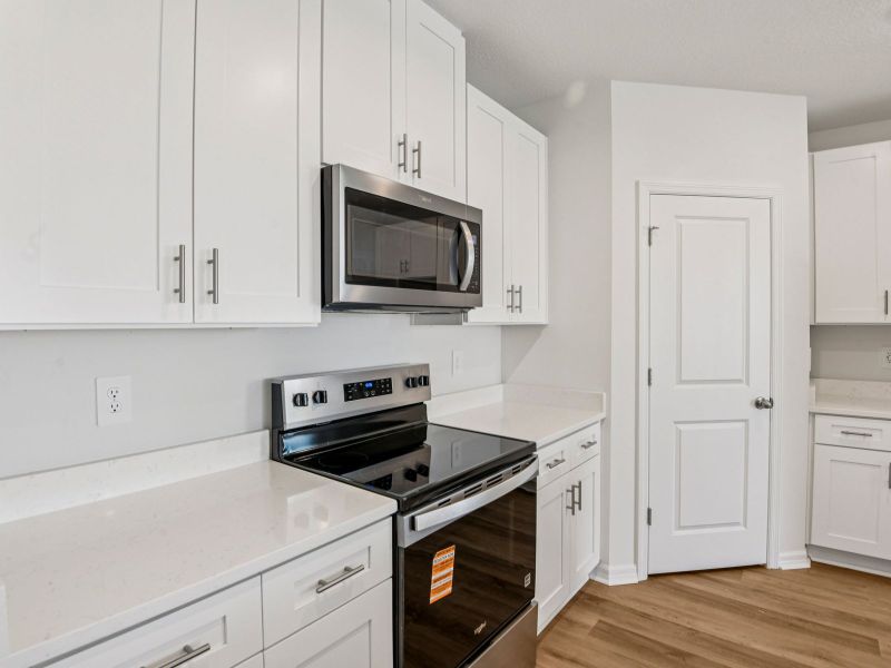 Furnished interior view inside a new home in Hilltop Vistas, Dade City (Image 7).