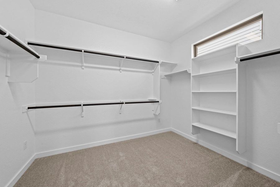 Walk-in closet in Primary Bedroom Walk-in closet in Primary Bedroom