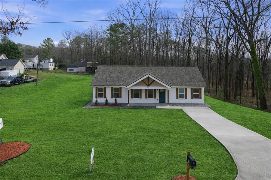 Front exterior of a new home in , Hiram, GA, highlighting curb appeal (Image 16).