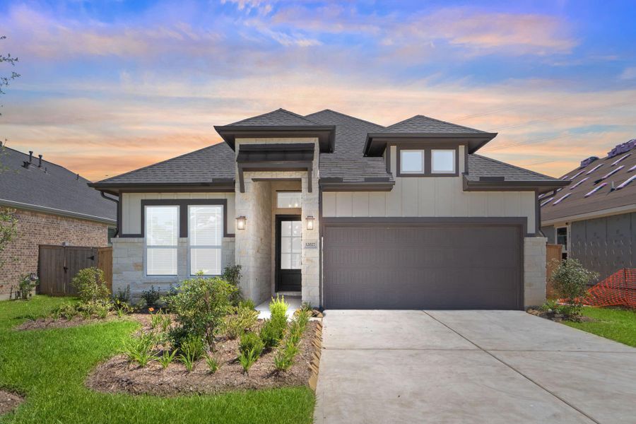 Front exterior of a new home in Mulberry Farms, Santa Fe, TX, highlighting curb appeal (Image 27).