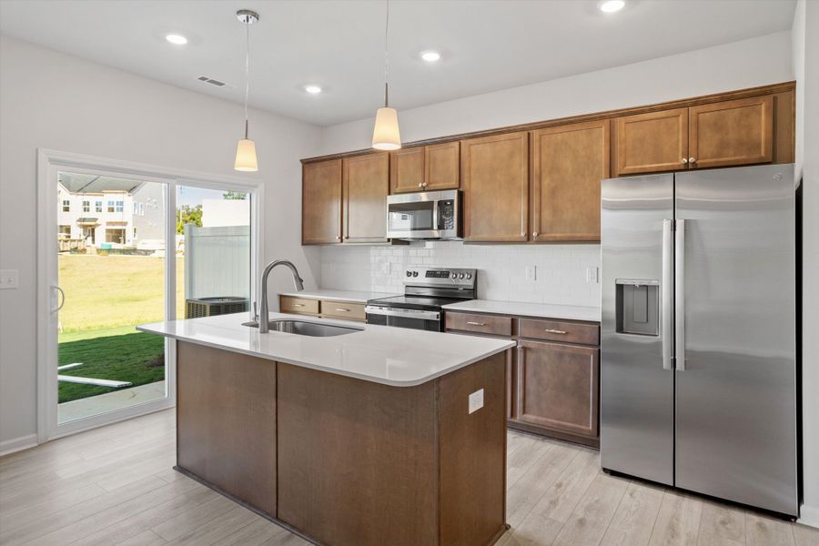 Furnished interior view inside a new home in West Main Townhomes, Sanford (Image 11).