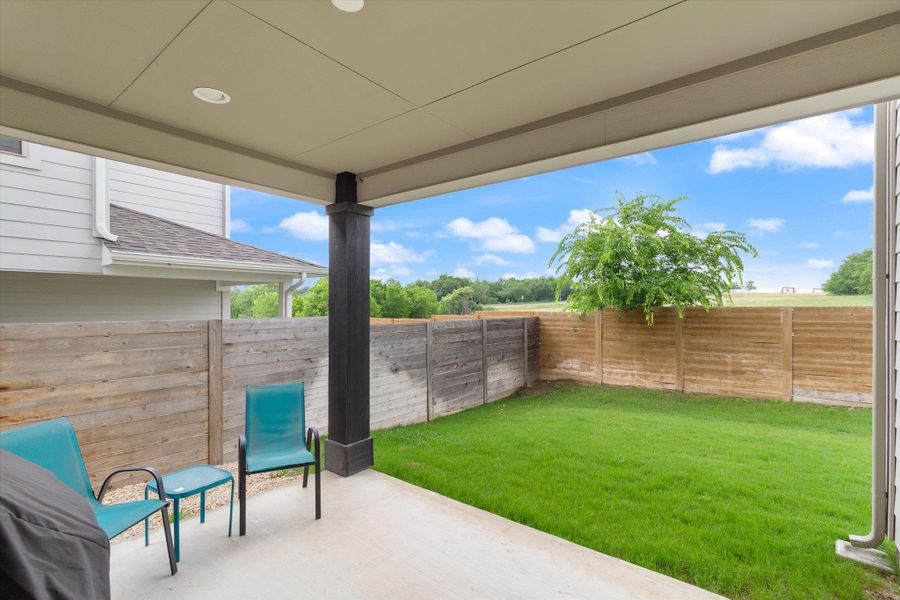 Fenced backyard featuring a patio area