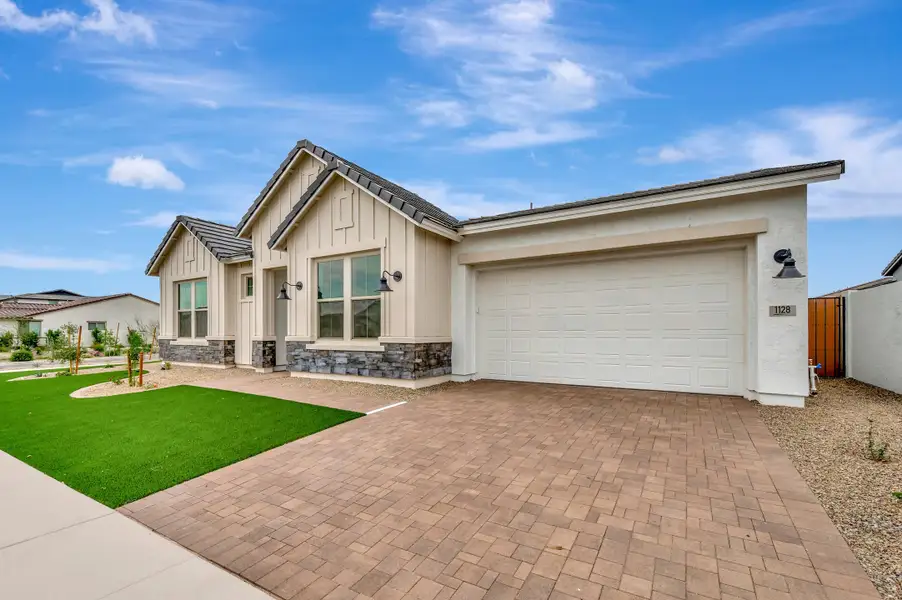 Front exterior of a new home in Escena at Blossom Rock, Apache Junction, AZ, highlighting curb appeal (Image 2).