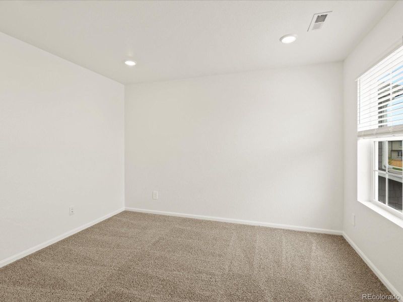 Spacious, unfurnished interior of a new home in Ridgeline Vista: The Flora Collection, Brighton (Image 29).