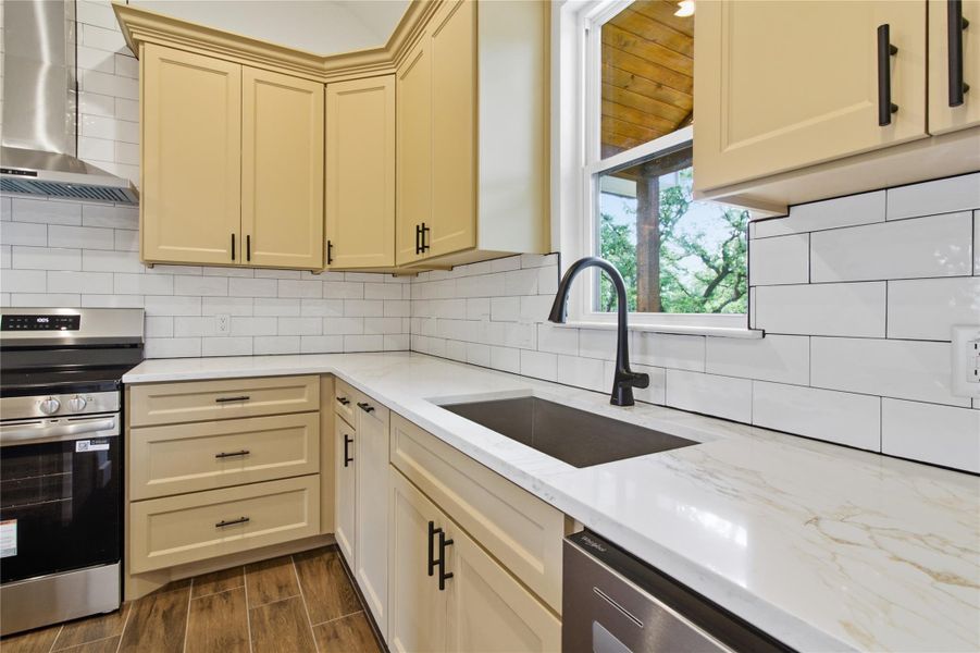 A well-appointed kitchen features ample cabinetry, gleaming countertops, and a full suite of appliances. A well-appointed kitchen features ample cabinetry, gleaming countertops, and a full suite of appliances.