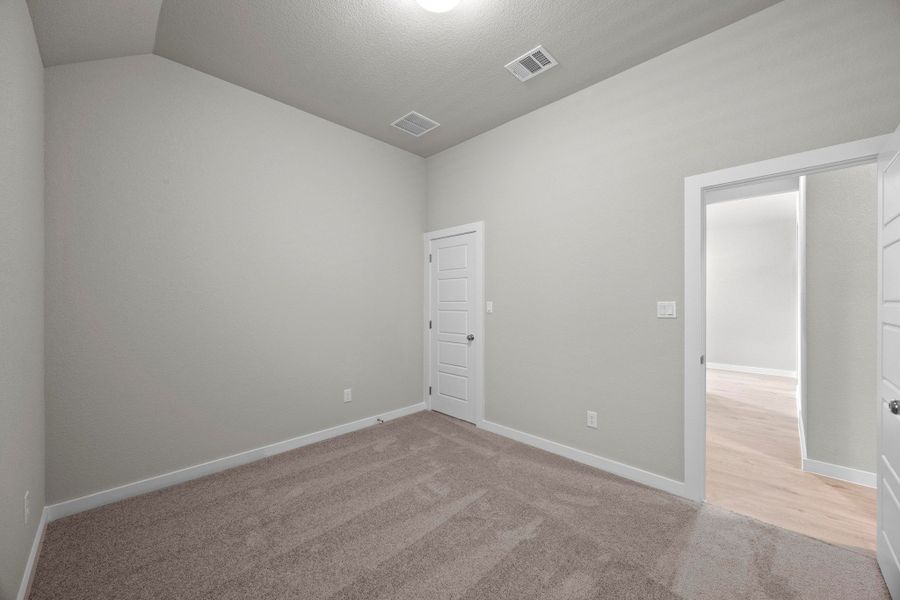 Bedroom in the Cedar home plan by Trophy Signature Homes – REPRESENTATIVE PHOTO