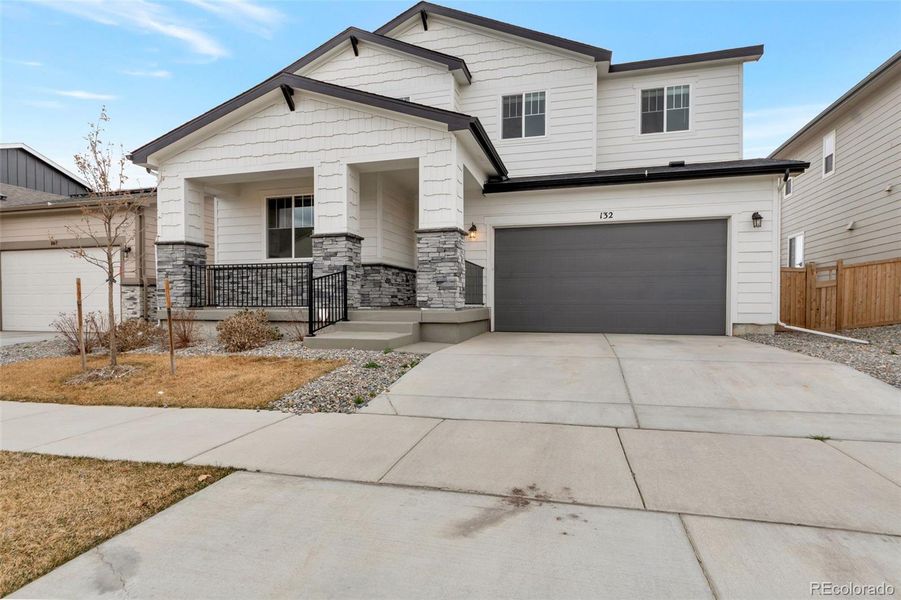 Front exterior of a new home in , Brighton, CO, highlighting curb appeal (Image 21).