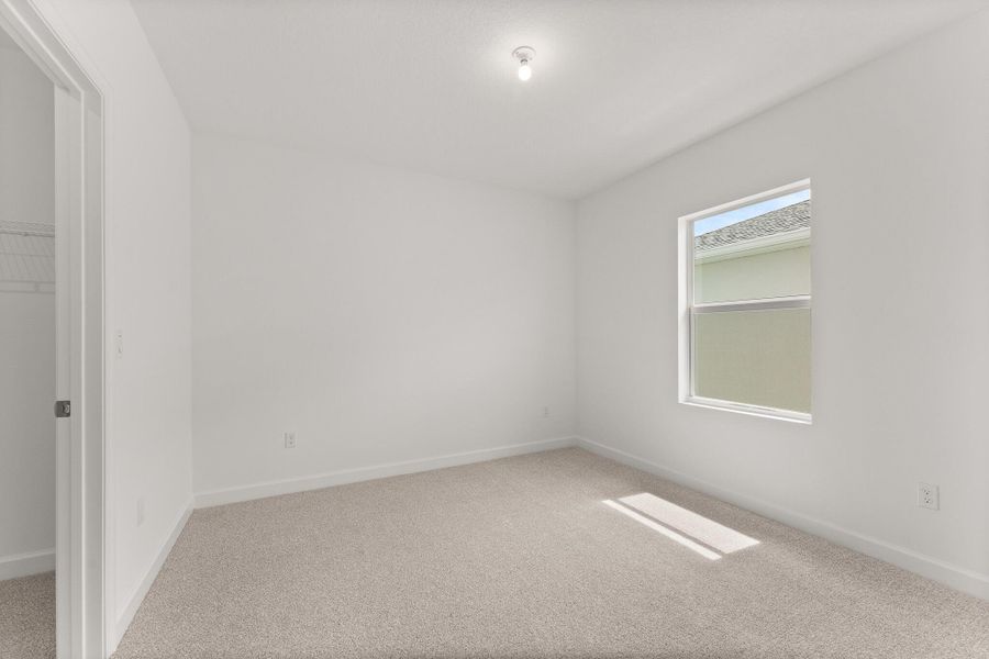 Spacious, unfurnished interior of a new home in Tradition - Cadence, Port St. Lucie (Image 18).