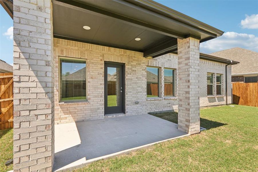 Exterior details and patio area of a home in Parks at Foster Crossing - Premier Series, Anna (Image 3). Exterior details and patio area of a home in Parks at Foster Crossing - Premier Series, Anna (Image 3).