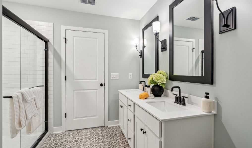 Primary bath with glass-shower enclosure