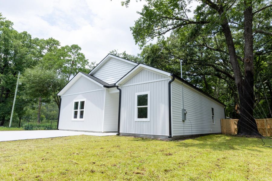 Front exterior of a new home in , North Charleston, SC, highlighting curb appeal (Image 1). Front exterior of a new home in , North Charleston, SC, highlighting curb appeal (Image 1).