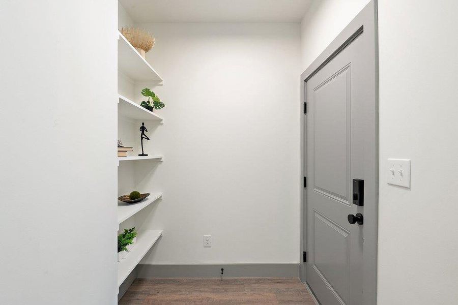 View of front door and entrance hall.