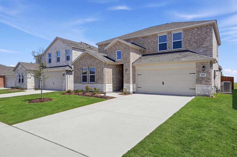 Front exterior of a new home in Parks at Foster Crossing, Anna, TX, highlighting curb appeal (Image 17).