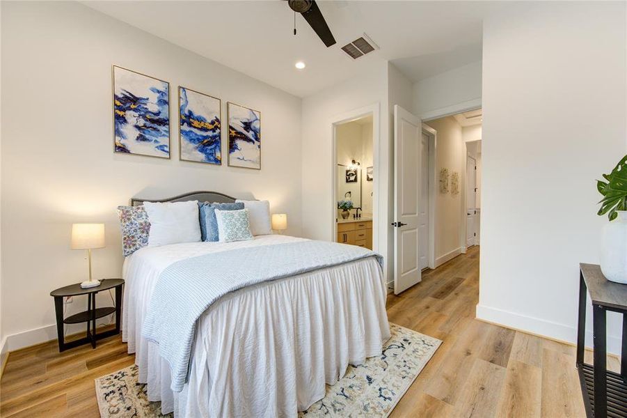 Guest Bedroom 2. All bedrooms feature LVP flooring, recessed LED lights, sleek black ceiling fans and large walk-in closets.