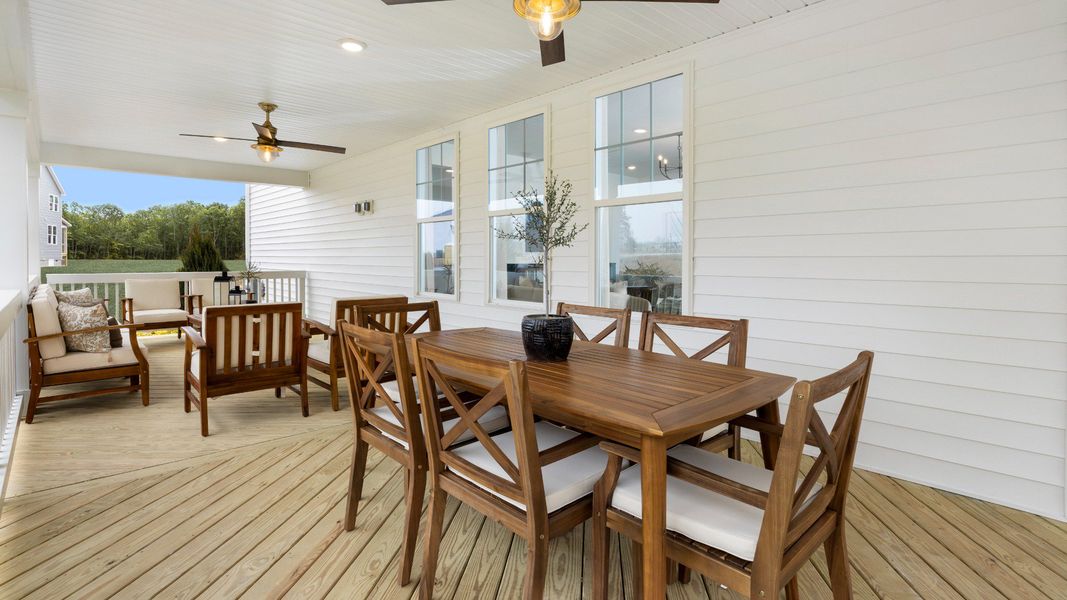 Townsend home plan covered back porch with ceiling fans spanning entire length of the home for optimal outdoor living