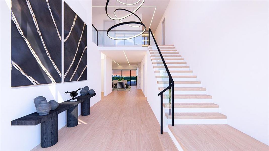 Stairway with wood finished floors, a high ceiling, and a chandelier Stairway with wood finished floors, a high ceiling, and a chandelier