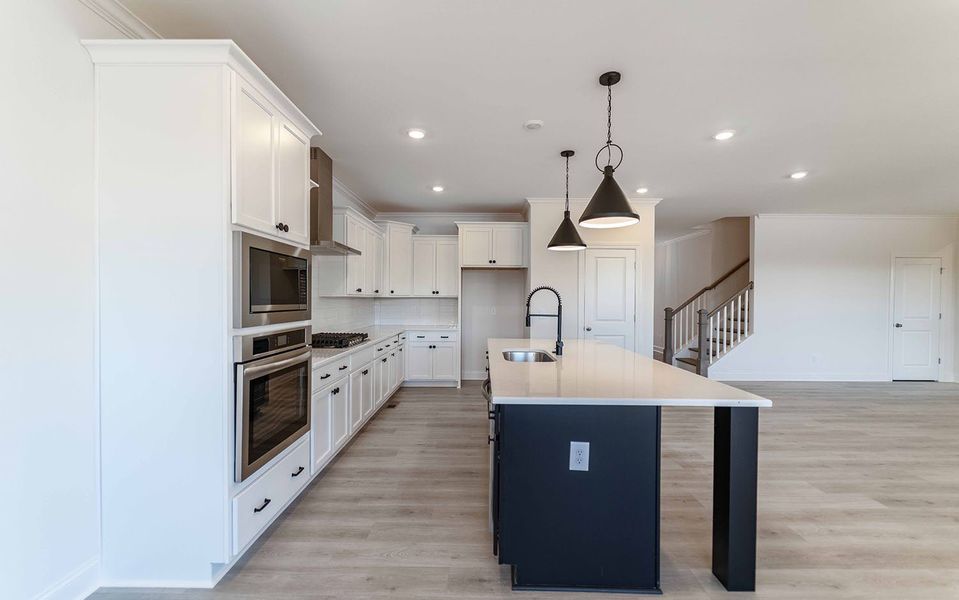 Furnished interior view inside a new home in Aden Woods, Fairview (Image 5).