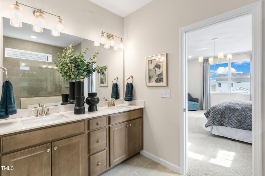 owner's bathroom with tile floors