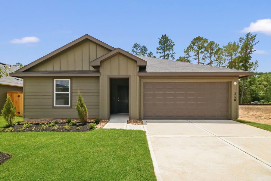 Front exterior of a new home in New Waverly Station, New Waverly, TX, highlighting curb appeal (Image 2). Front exterior of a new home in New Waverly Station, New Waverly, TX, highlighting curb appeal (Image 2).
