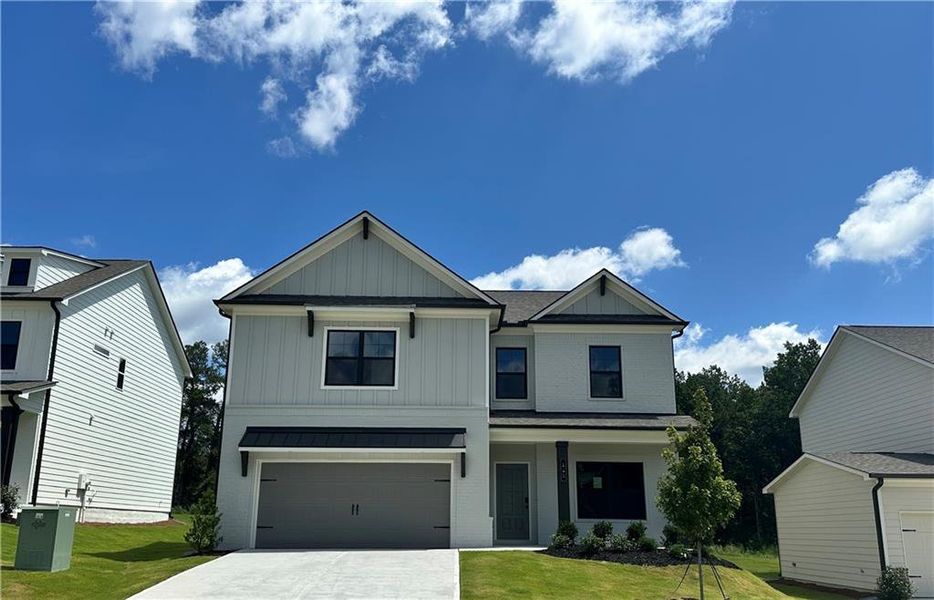 Front exterior of a new home in Summerlin, Winder, GA, highlighting curb appeal (Image 17).
