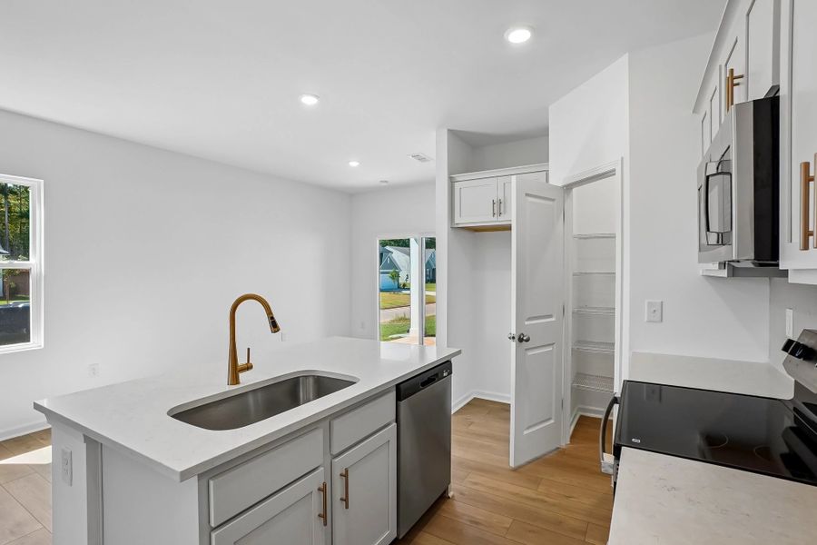 Kitchen featuring the AW Collection® Serene - Clean lines and earthy textures define the space.
