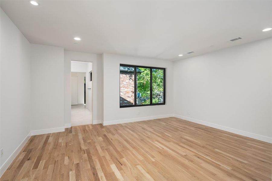 Spare room with light hardwood / wood-style flooring