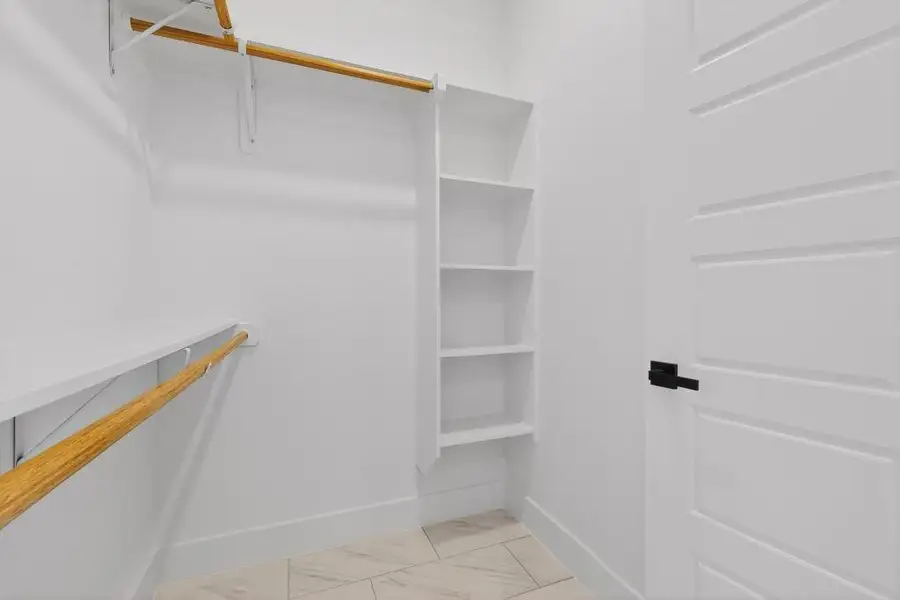 View of walk in closet View of walk in closet