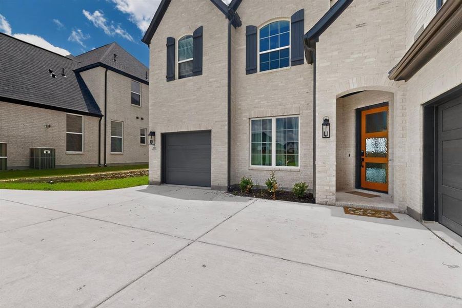 Exterior details and patio area of a home in The Homestead - 62', Rockwall (Image 24). Exterior details and patio area of a home in The Homestead - 62', Rockwall (Image 24).