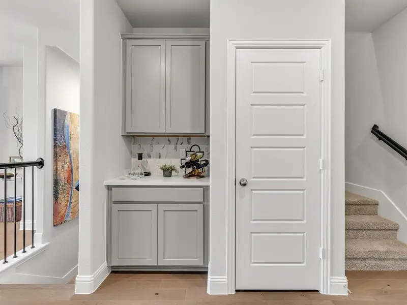 The dedicated built-in serving bar adds an upscale entertaining touch, perfect for coffee stations, wine collections, or cocktails.