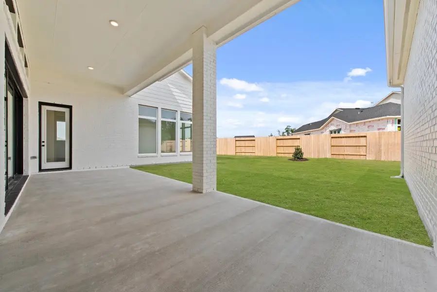 Exterior details and patio area of a home in ARTAVIA®, Conroe (Image 2). Exterior details and patio area of a home in ARTAVIA®, Conroe (Image 2).