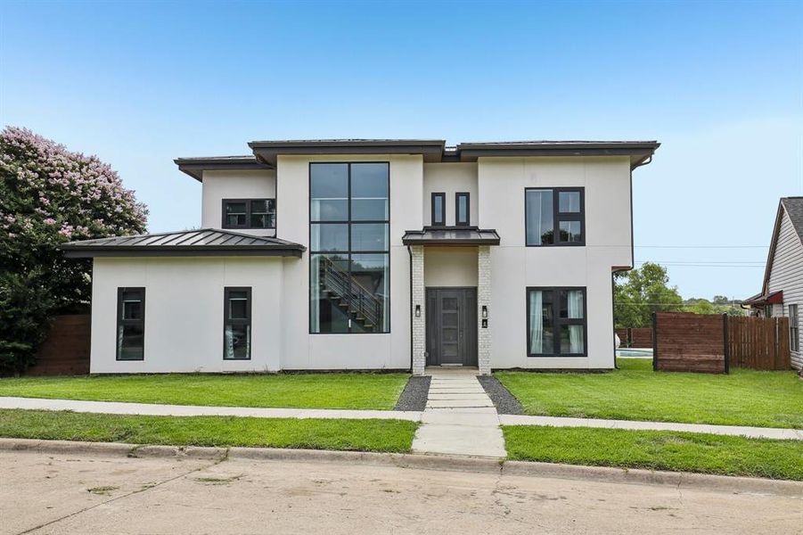 Front exterior of a new home in , The Colony, TX, highlighting curb appeal (Image 17). Front exterior of a new home in , The Colony, TX, highlighting curb appeal (Image 17).