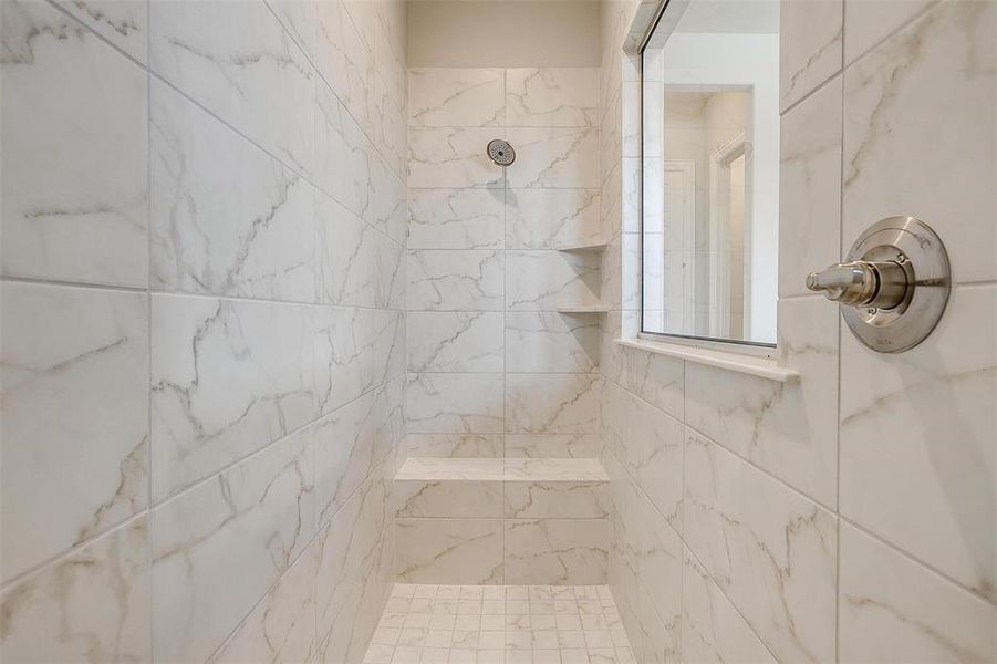 Bathroom with tiled shower