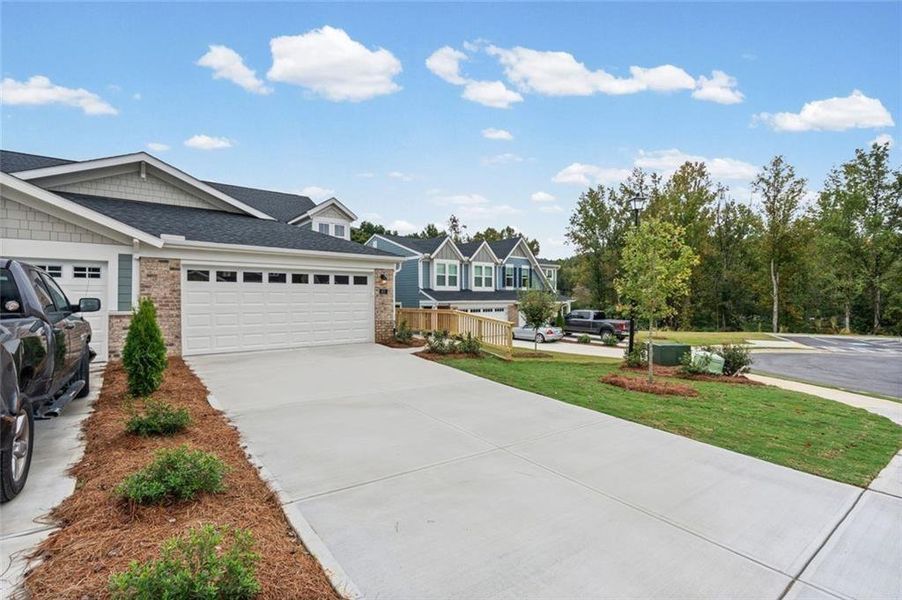 Front exterior of a new home in Villas at Gold Creek, Dawsonville, GA, highlighting curb appeal (Image 18).
