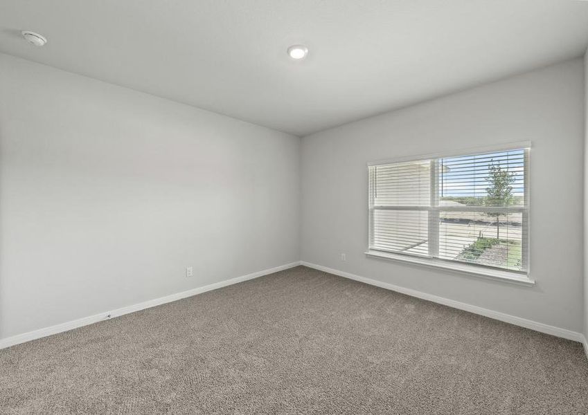 The master bedroom has a large window with wonderful natural light.