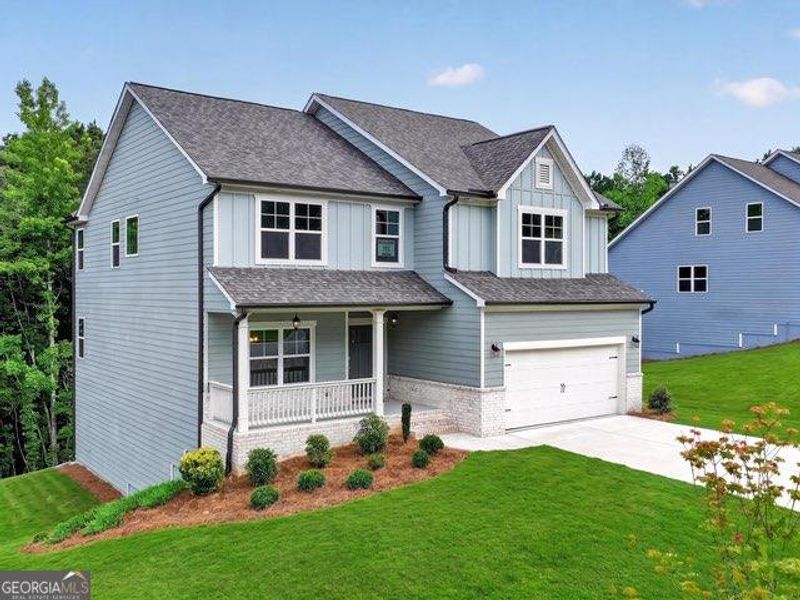 Front exterior of a new home in , Dallas, GA, highlighting curb appeal (Image 2). Front exterior of a new home in , Dallas, GA, highlighting curb appeal (Image 2).