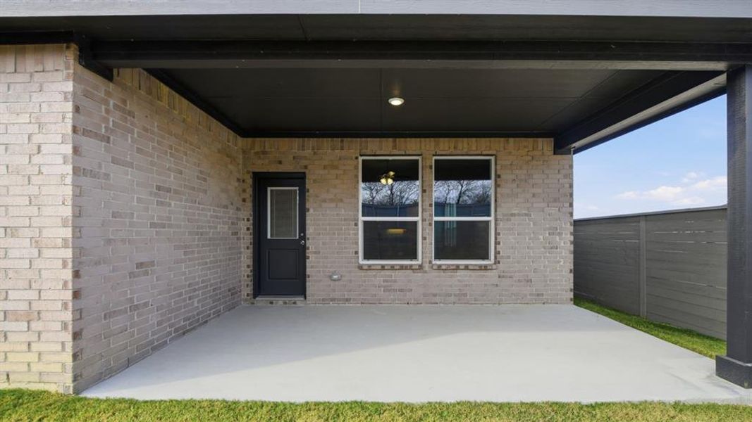 Exterior details and patio area of a home in Treeline, Justin (Image 2).