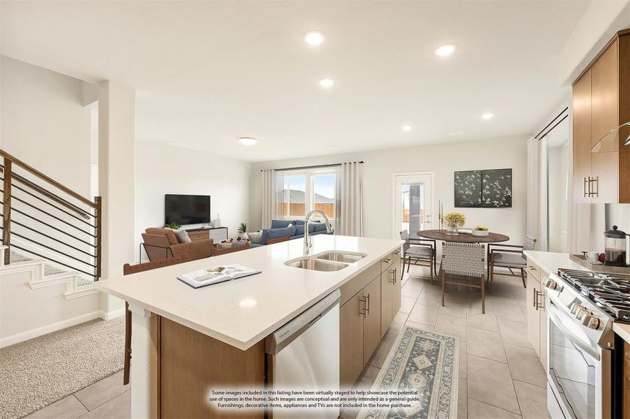 Open-concept kitchen with island sink, wood cabinets, and gas range flowing into dining and living areas Open-concept kitchen with island sink, wood cabinets, and gas range flowing into dining and living areas