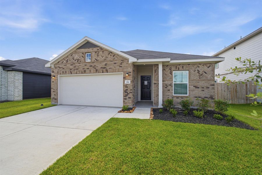 Front exterior of a new home in Trails at Woodhaven Lakes, La Marque, TX, highlighting curb appeal (Image 18). Front exterior of a new home in Trails at Woodhaven Lakes, La Marque, TX, highlighting curb appeal (Image 18).