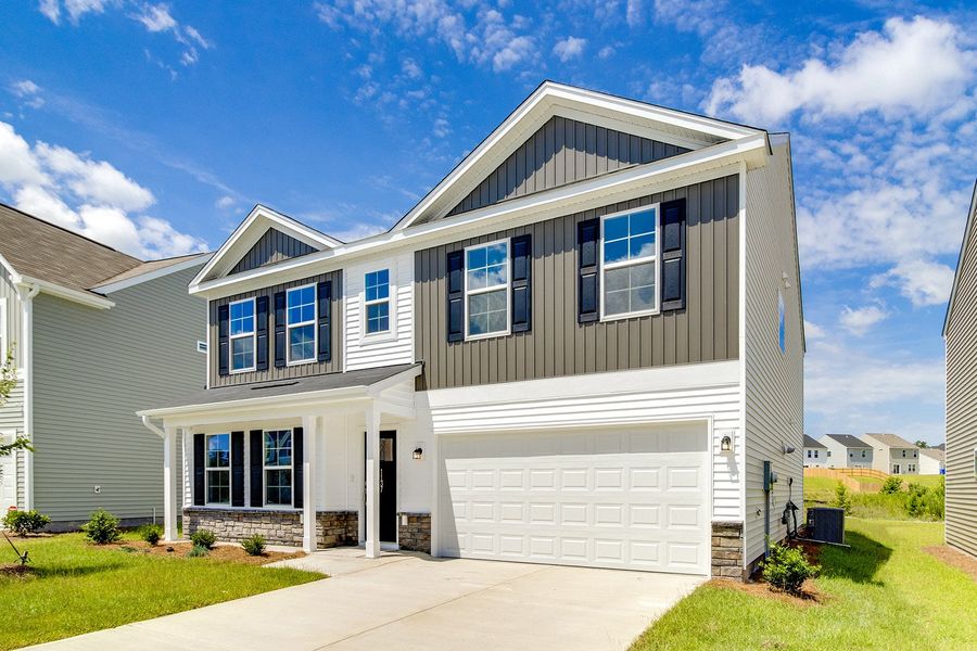 Front exterior of a new home in Ellington, Elgin, SC, highlighting curb appeal (Image 2). Front exterior of a new home in Ellington, Elgin, SC, highlighting curb appeal (Image 2).