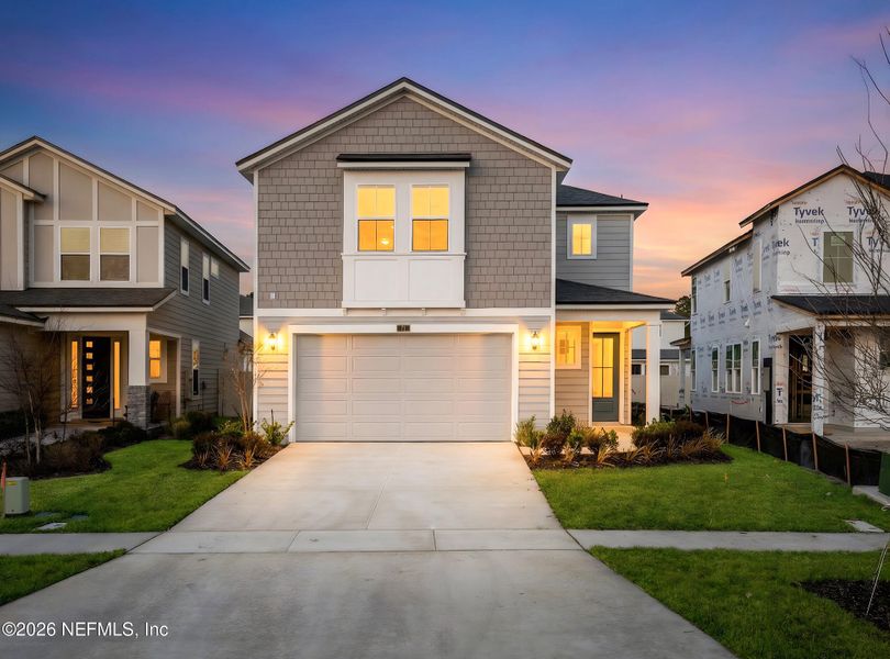 Front exterior of a new home in Crosswinds at Nocatee, Ponte Vedra, FL, highlighting curb appeal (Image 24).