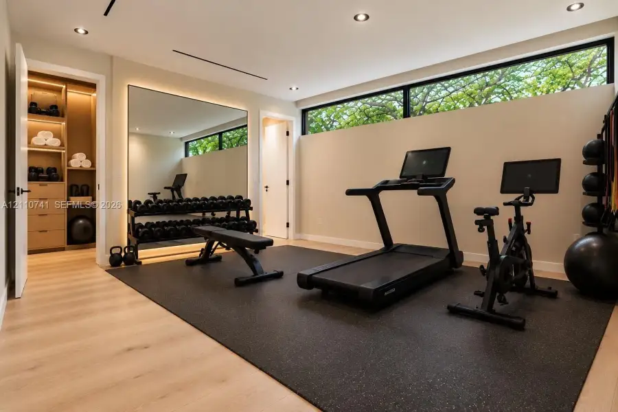 bedroom with en-suite/ gym virtually staged for illustrative purposes bedroom with en-suite/ gym virtually staged for illustrative purposes