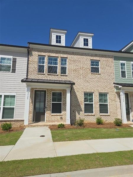 Front exterior of a new home in , Flowery Branch, GA, highlighting curb appeal (Image 2). Front exterior of a new home in , Flowery Branch, GA, highlighting curb appeal (Image 2).