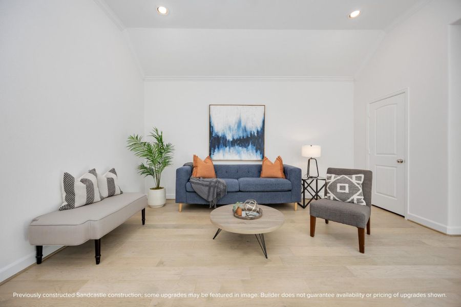Crisp lines, curated color pops, and soft natural light make this upstairs living area feel like a boutique hotel lounge—right in your own home.