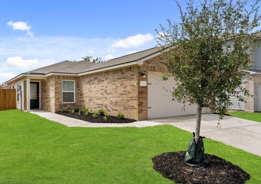 The brick home with gorgeous front yard landscaping